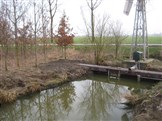 stuw met windmolen te pompveld Andel